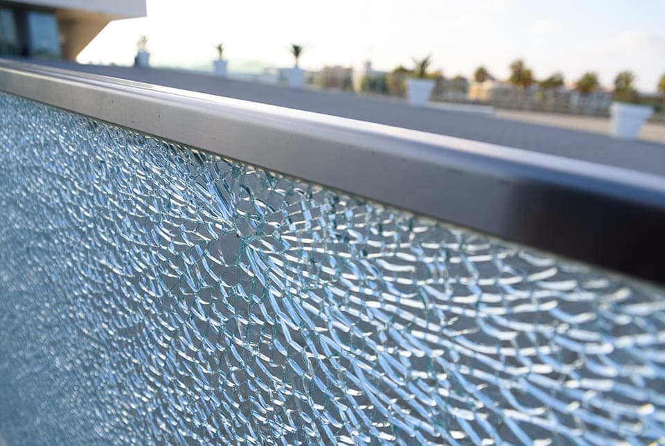 Shattered and cracked glass railing